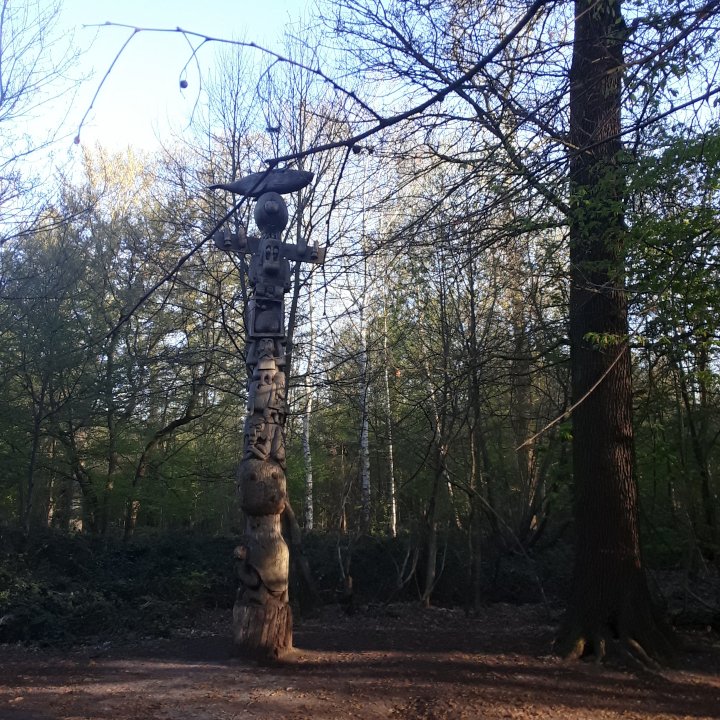A craved wooden totem pole in the heart of Bois de Vincennes